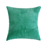 coussin en velours de couleur vert emeraude